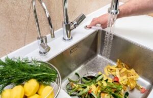 Kitchen sink with a garbage disposal.